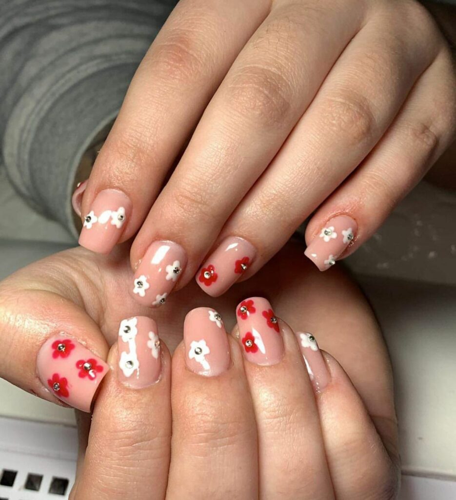 Gem-Encrusted Red and White Flower Nails