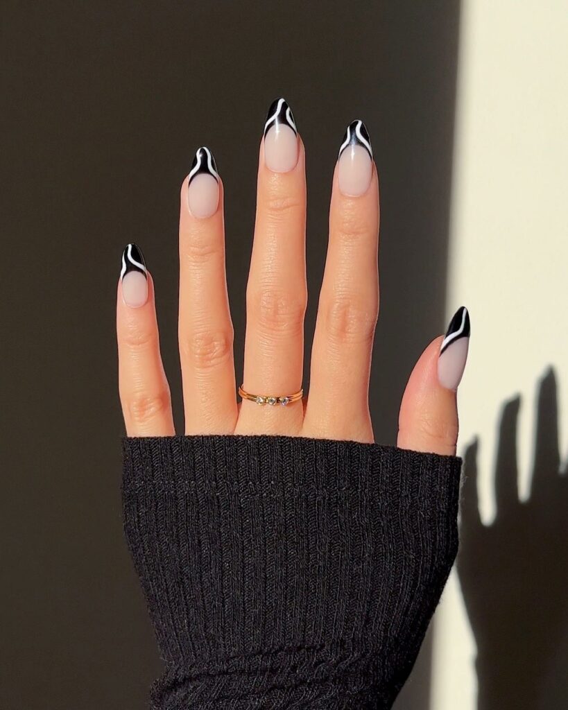 Sleek Black and White Almond Nails