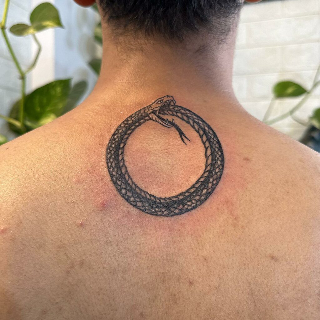 Snake Eating Itself Tattoo