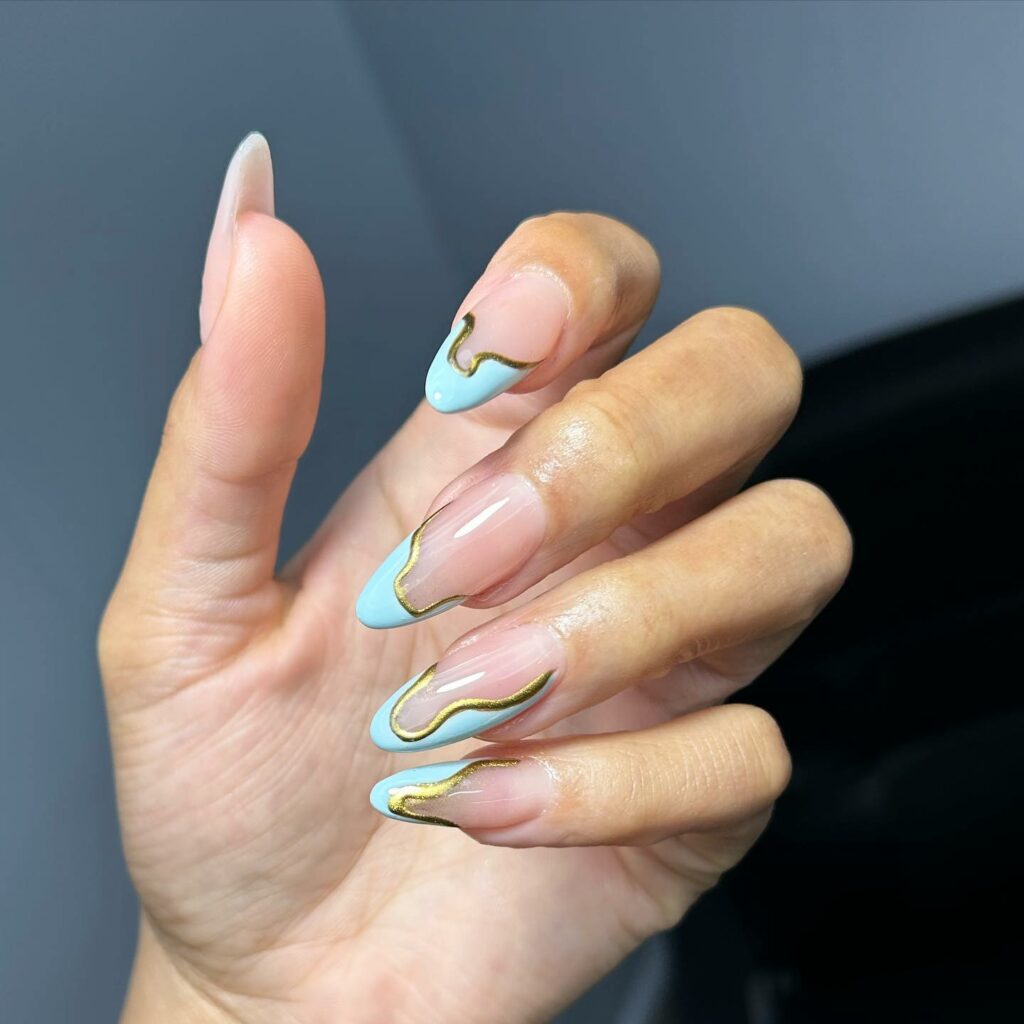 Blue And Gold Tips On A Clear Pink Nail 