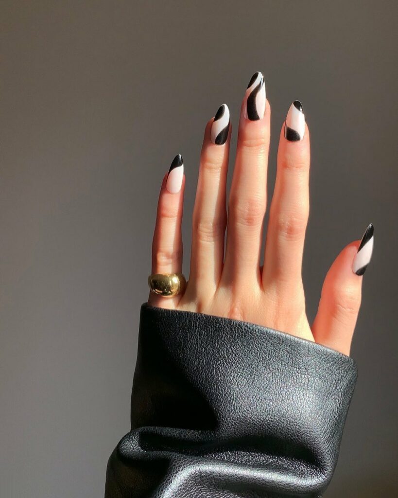 Sleek Almond Black and White Nails