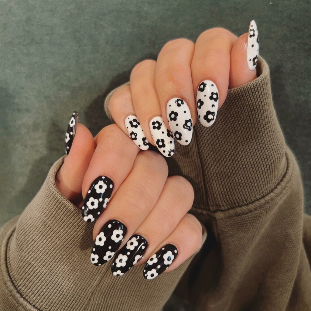 Elegant Floral Patterns on Black & White Nails