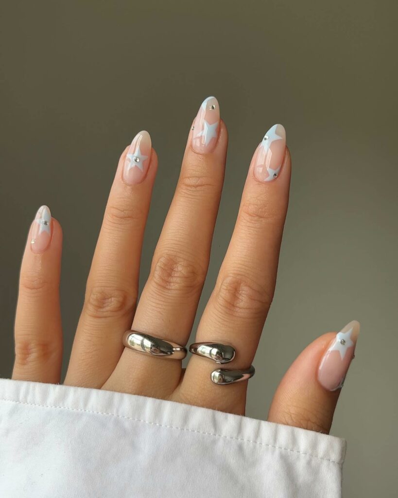 Celestial Blue Nails Adorned with Stars