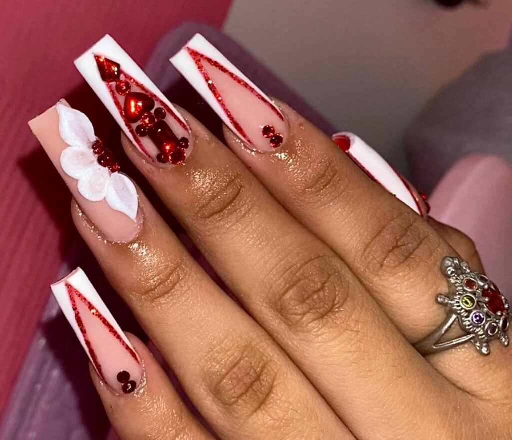 Floral Designs on Red and White Nails