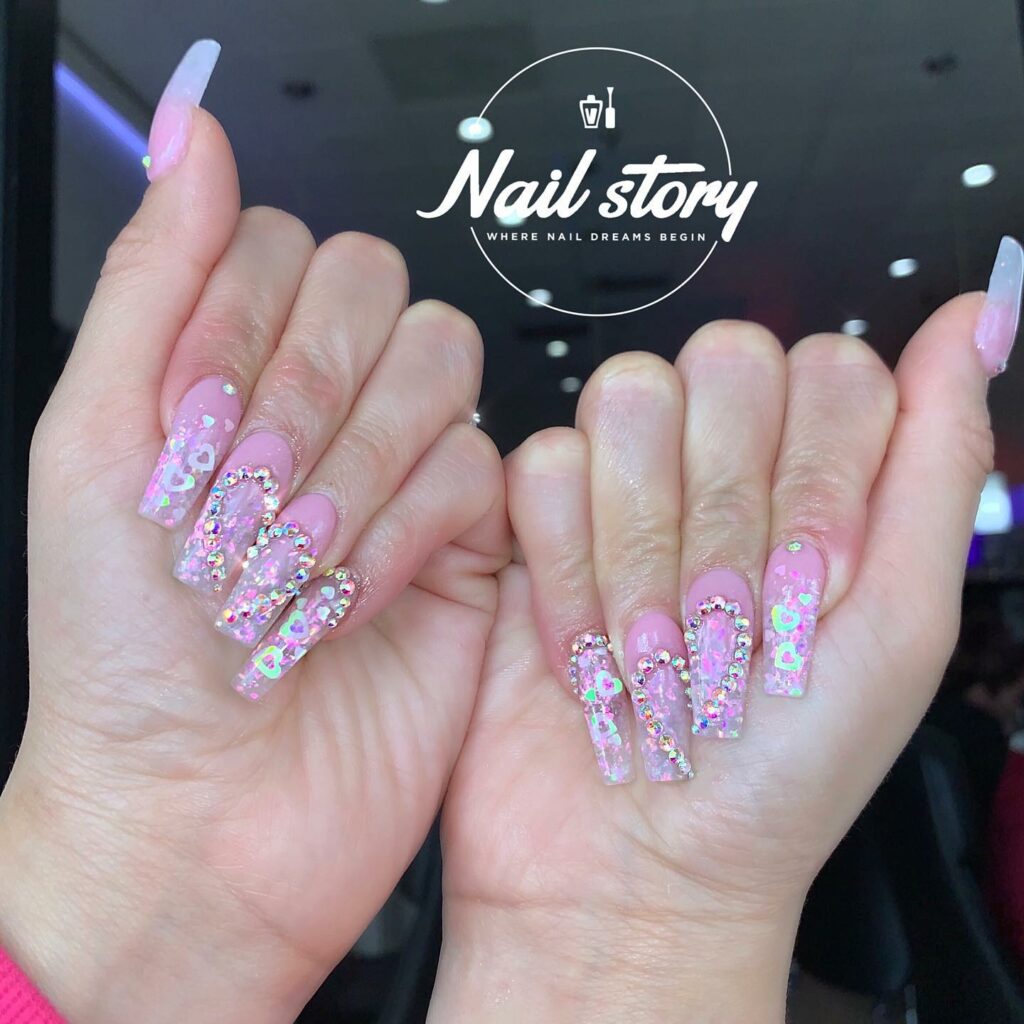 Heart Motifs on Clear Pink Nails