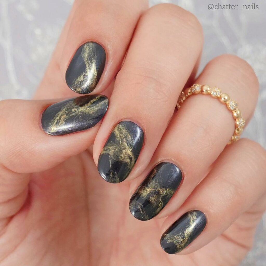 Marbled Black and Gold Nails