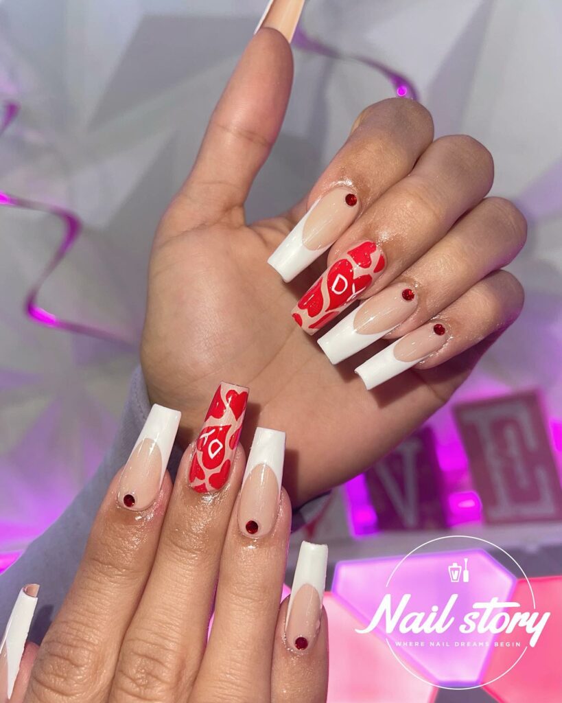 Nude Tones with Red and White Accents on Nails