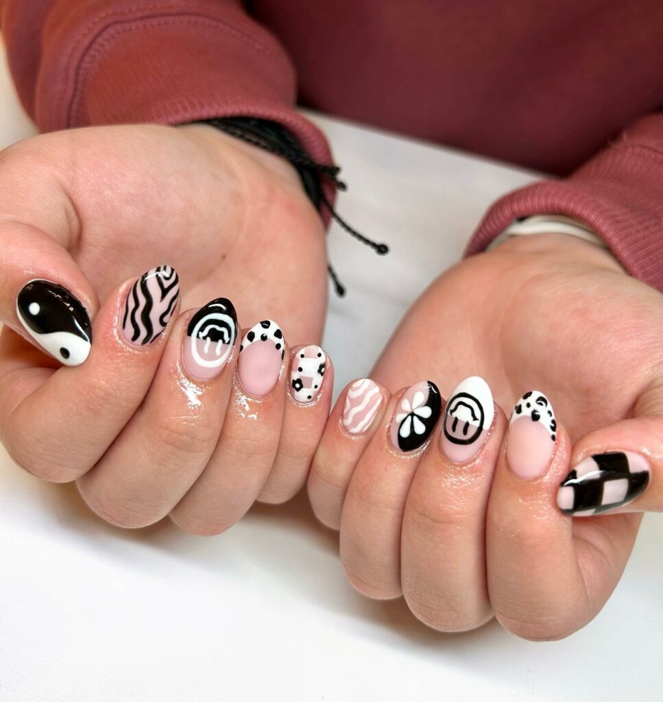 Black & White Nails with Unique Artistic Motifs