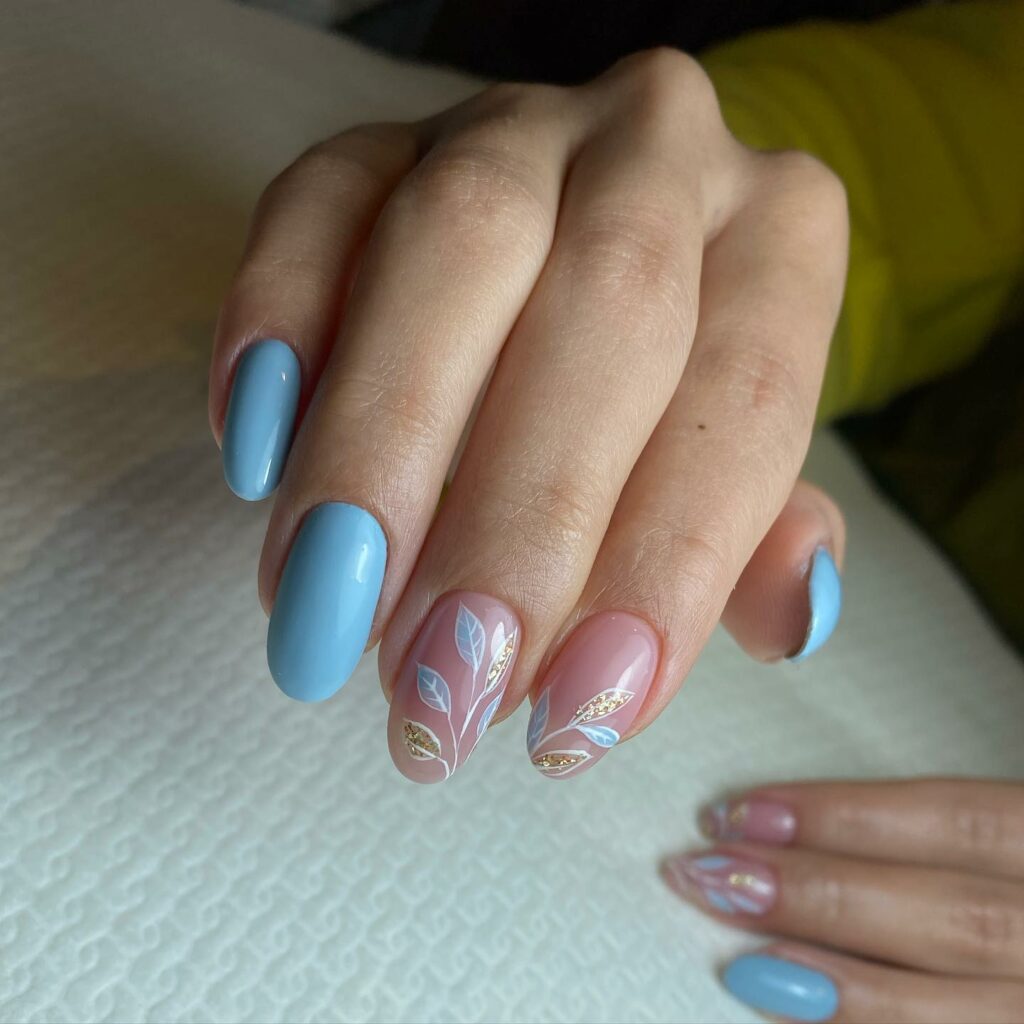 Pink and Blue Nails with Floral Embellishments