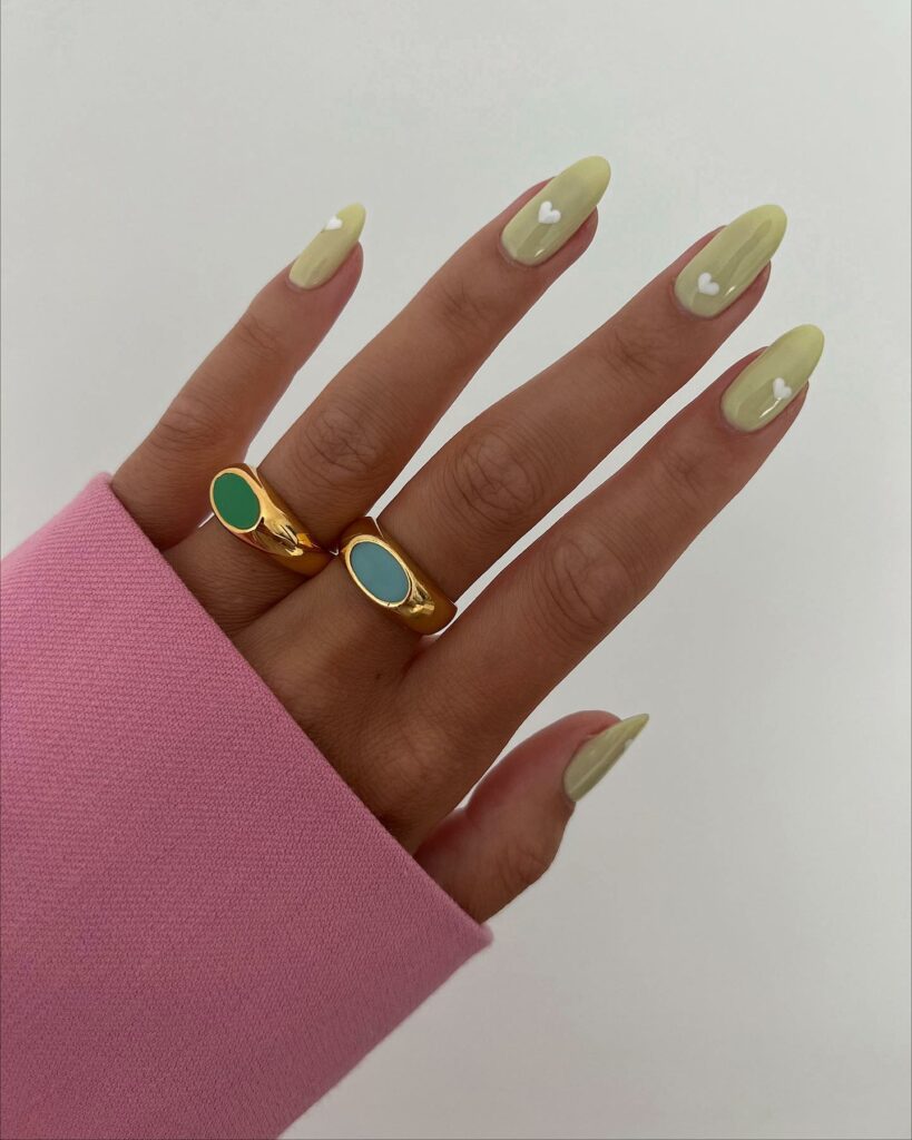 Sage Green Nails Adorned with Delicate Heart Motifs