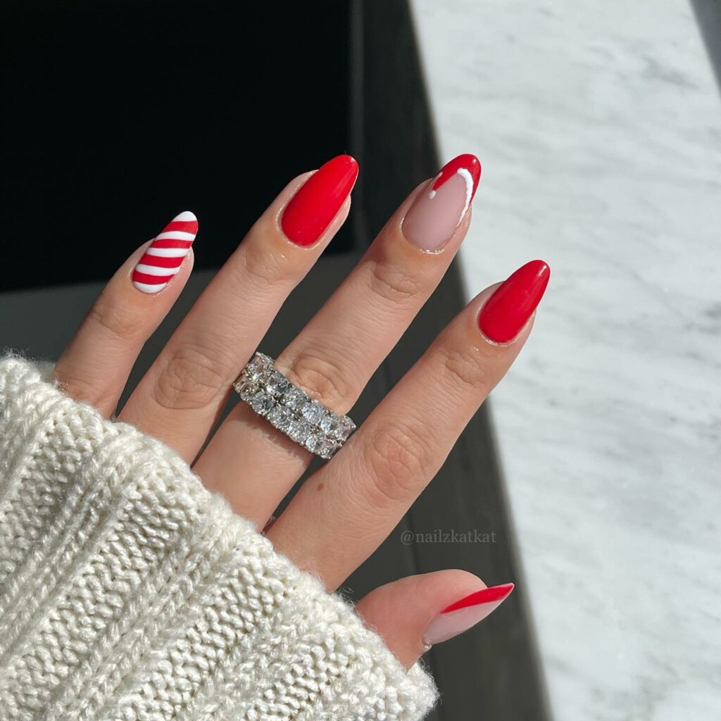 Santa Hat Meets Candy Swirl in Red and White Nails