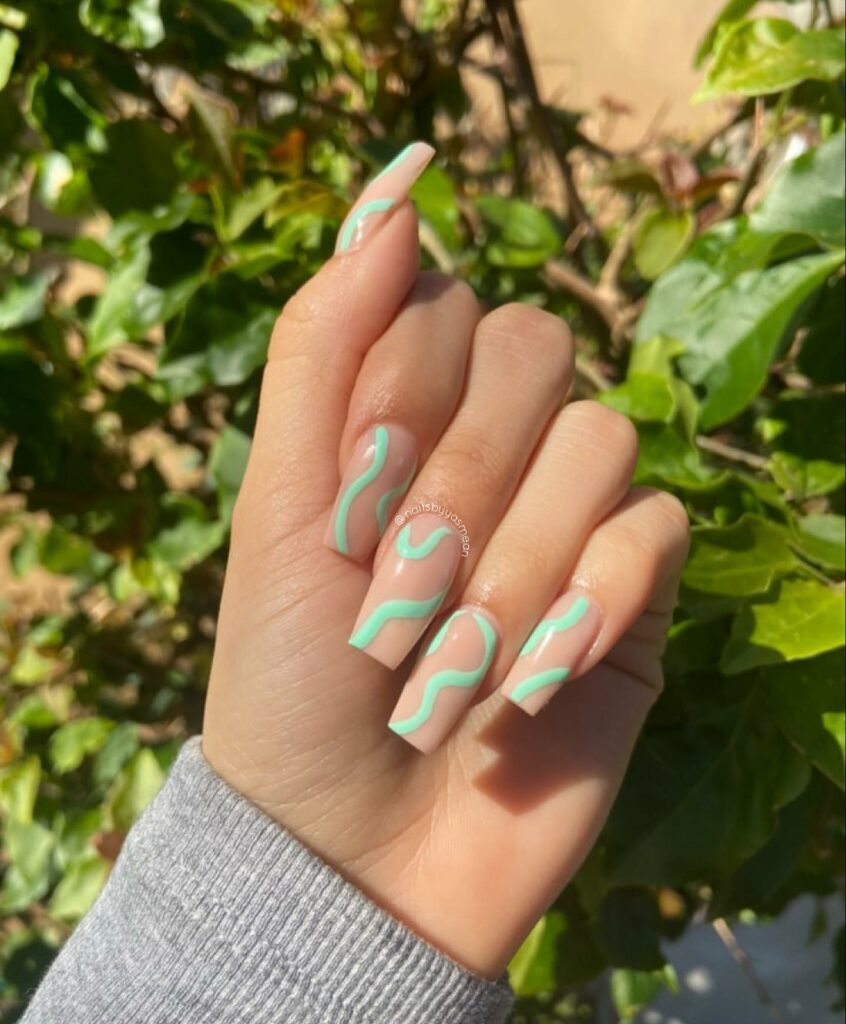 Elegant Nude Nails with Subtle Mint Green Accents