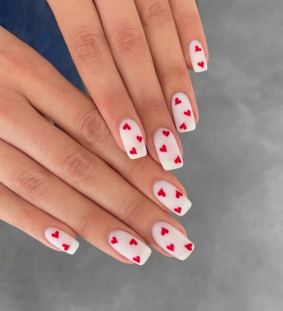 Tiny Heart Designs on Red and White Nails