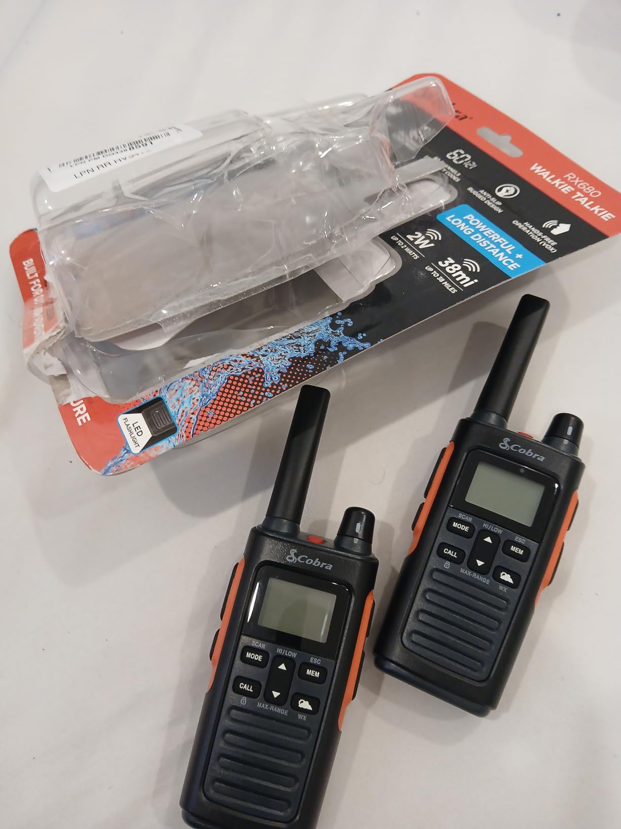 Cobra RX680 Walkie Talkies (2-Pack) - Rugged & Splashproof Two Way Radios Long Range, IP54 Water Resistant Design, 60 Pre-Programmed Channels, Weather Alerts, Included Charging Dock (Black/Orange) Customer Review Cobra RX680 Walkie Talkies (2-Pack) - Rugged & Splashproof Two Way Radios Long Range, IP54 Water Resistant Design, 60 Pre-Programmed Channels, Weather Alerts, Included Charging Dock (Black/Orange) - Customer Photo 2