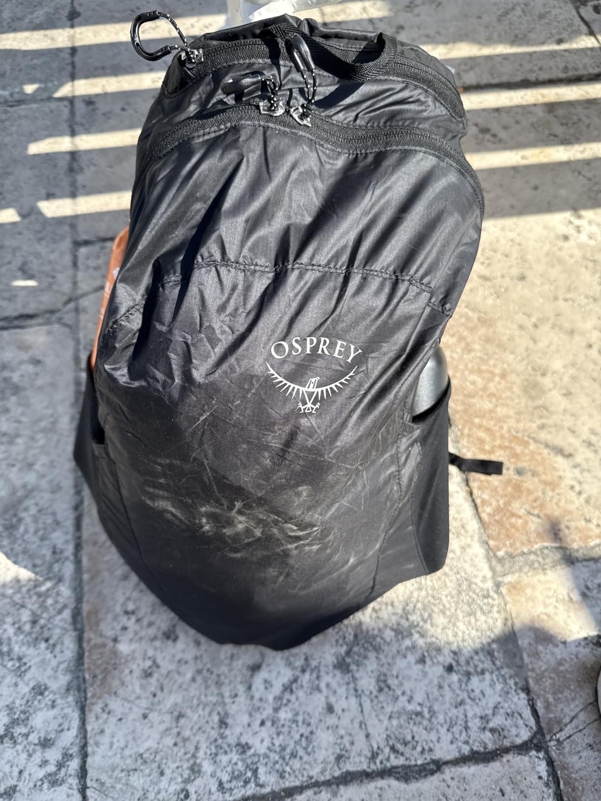 Osprey Ultralight Collapsible Stuff Pack - Lightweight, Packable Travel Backpack — Extra Bag For Travel and Every Day — 18 L Capacity Daypack to Expand Luggage, Black Customer Review Osprey Ultralight Collapsible Stuff Pack - Lightweight, Packable Travel Backpack — Extra Bag For Travel and Every Day — 18 L Capacity Daypack to Expand Luggage, Black - Customer Photo 3