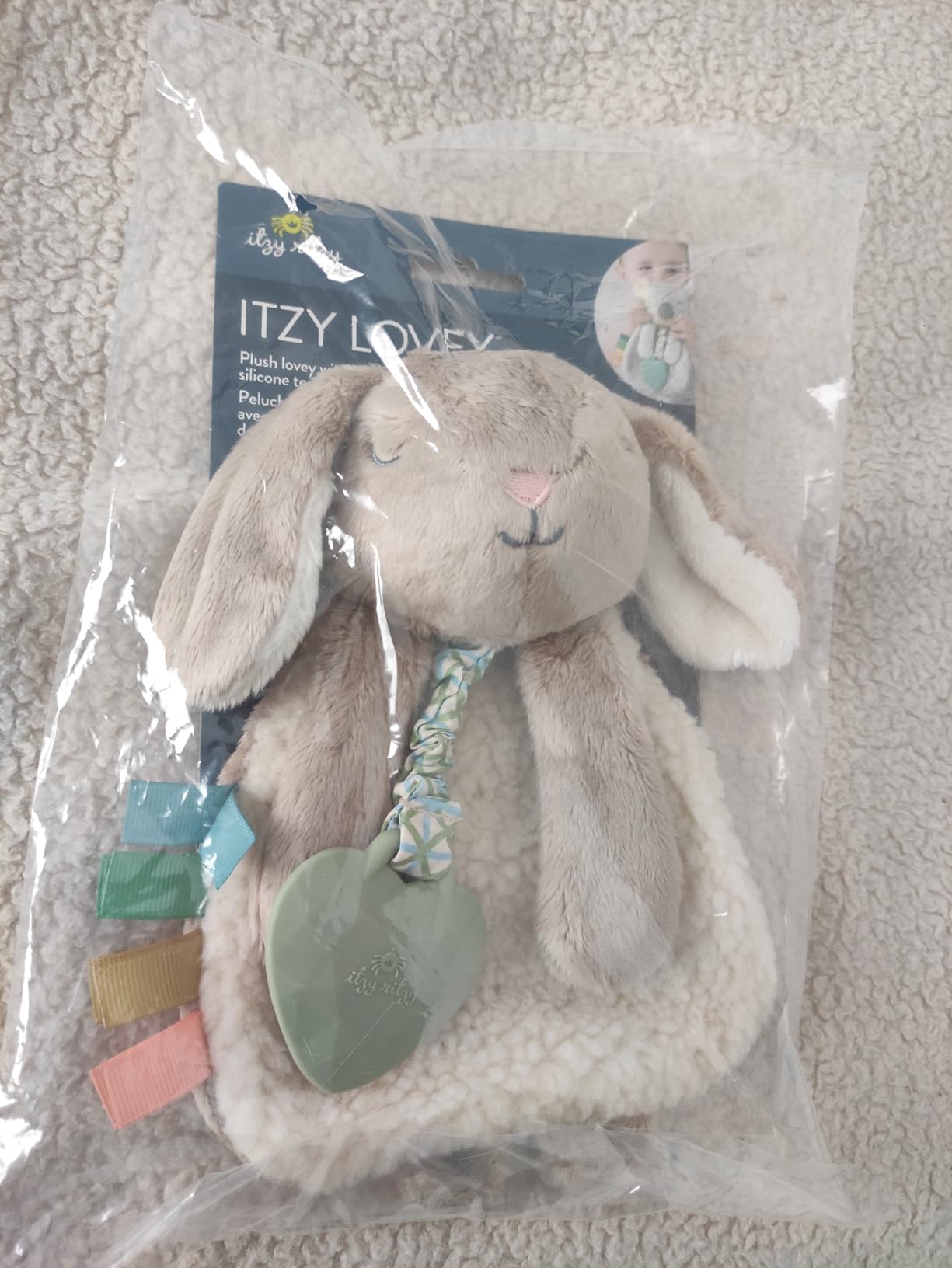 Itzy Ritzy - Itzy Lovey Including Teether - Baby Lovey with Teether, Textured Ribbons & Dangle Arms - Features Crinkle Sound, Sherpa Fabric and Minky Plush (Sloth) Customer Review Itzy Ritzy - Itzy Lovey Including Teether - Baby Lovey with Teether, Textured Ribbons & Dangle Arms - Features Crinkle Sound, Sherpa Fabric and Minky Plush (Sloth) - Customer Photo 1